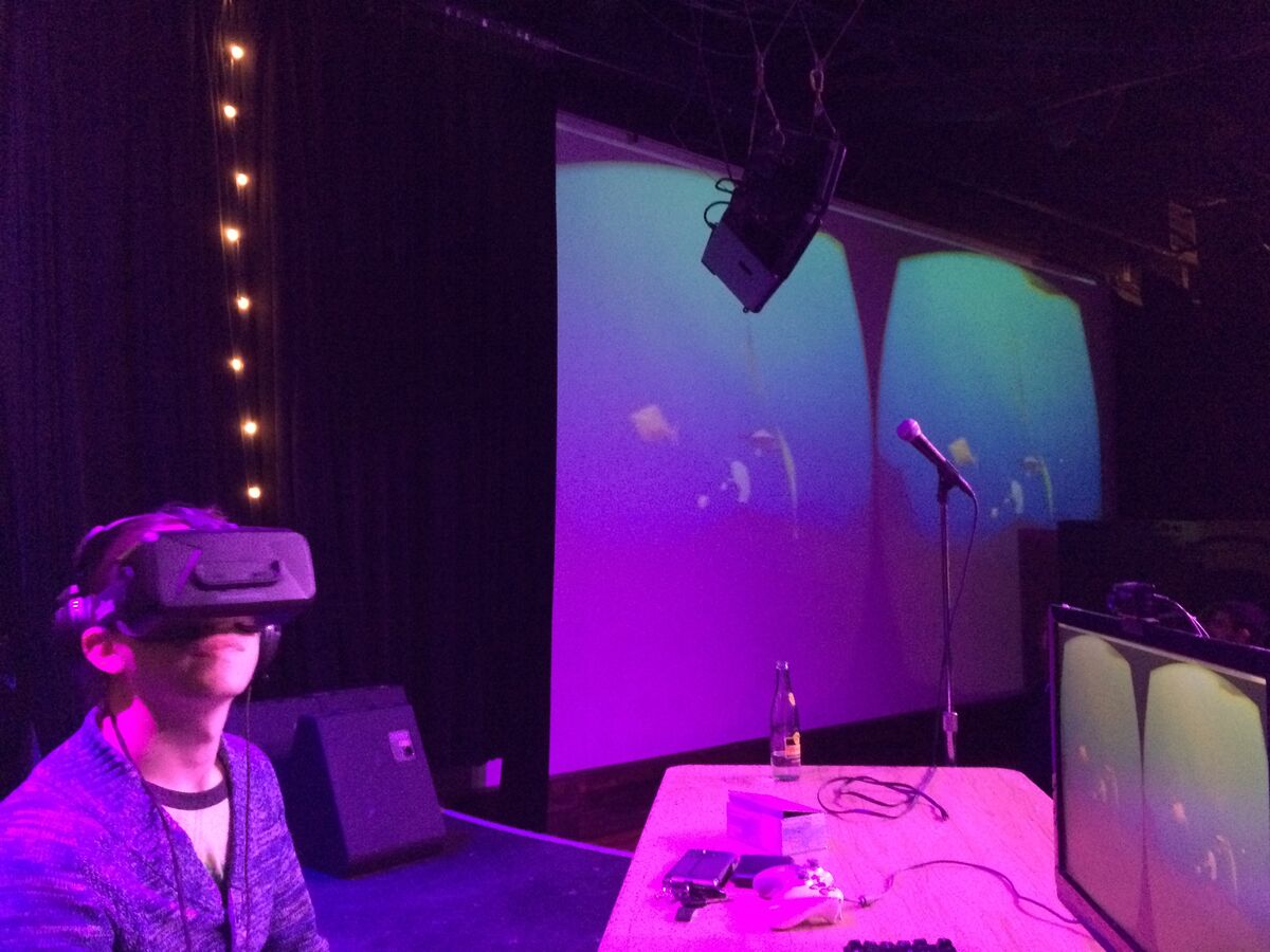 An attendee at the 2014 meetup wearing a VR headset, experiencing the early PolyFish underwater scene